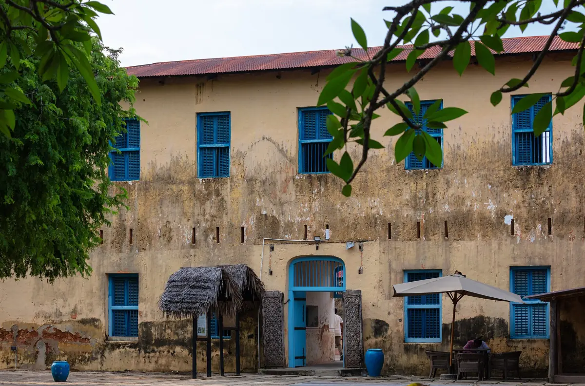 Old prison building on Changuu island with blue doors and windows