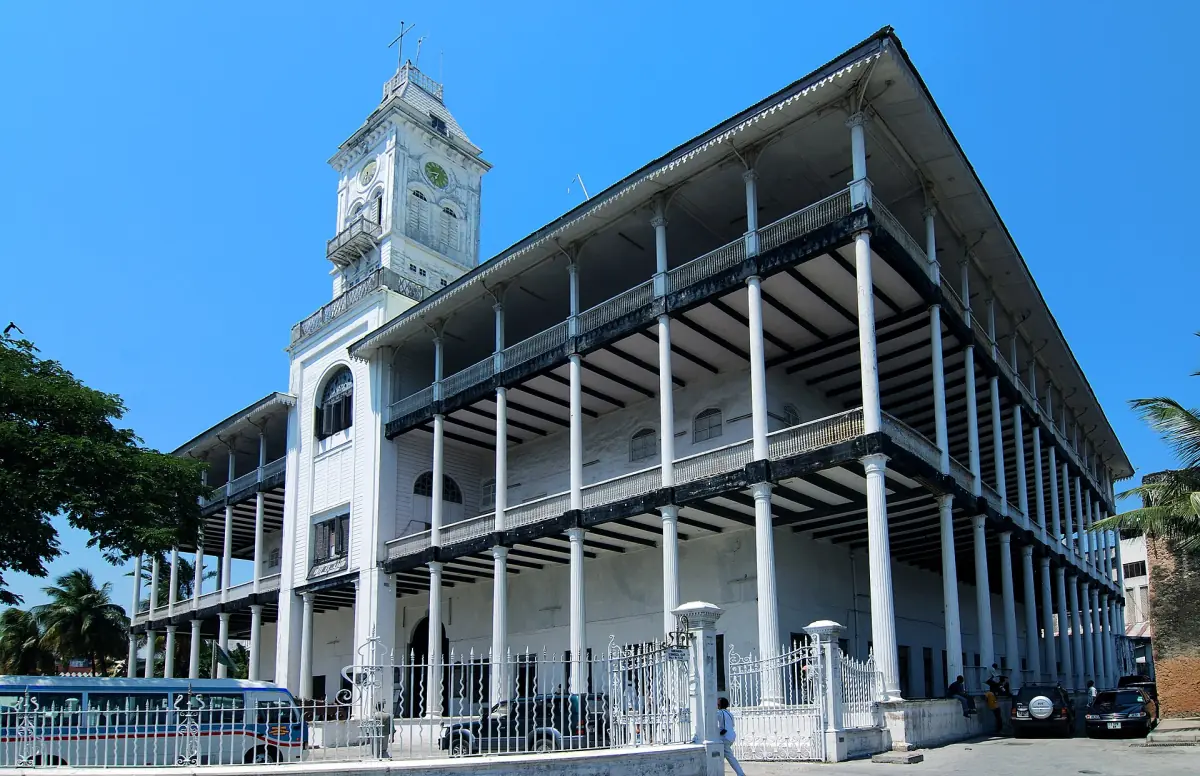 House of Wonders with its white columns and verandas under a blue sky