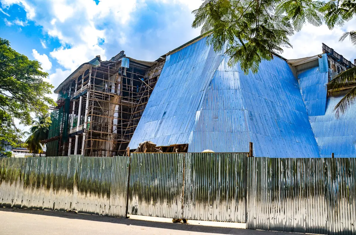 House of Wonders during restoration with scaffolding and a protective roof